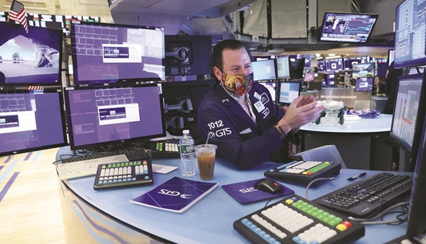 A trader works on the trading floor at the New York Stock Exchange. The S&P 500, tracking large and established firms, has stood relatively firm, hovering within 4% of its all-time high thanks to strength on the bottom line.