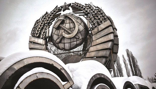 A picture taken this week shows a state emblem of former USSR, which was removed from Leninsky avenue after the collapse of the Soviet Union in 1991, displayed at a modern history sculpture park in Moscow. The 30th anniversary of Mikhail Gorbachevu2019s resignation as president of the USSR was marked on Christmas day. (AFP)