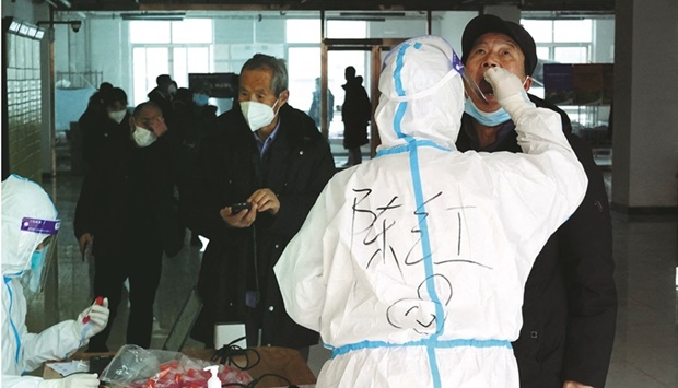 Somali military supporting Prime Minister Mohamed Hussein Roble walk as they gather at Siigale village in Hodan district of Mogadishu.