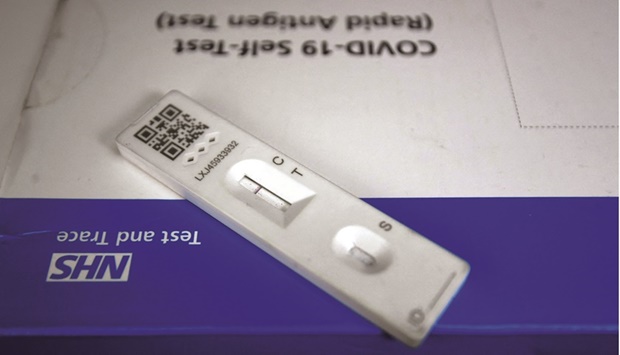A Covid-19 antigen self-test kit is seen at a medical outlet in London.