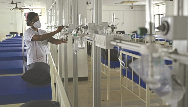 A medical staff works inside a newly created Covid-19 coronavirus oxygen support isolation ward at a government hospital in Chennai yesterday.
