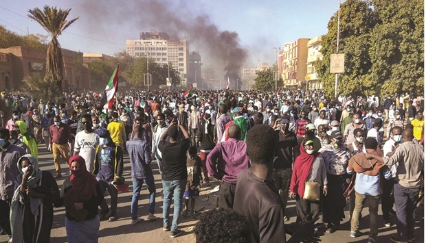 Tens of thousands protest in Khartoum against the armyu2019s October 25 coup. The placard reads in Arabic: u201cCivilian or eternal revolutionu201d. Demonstrators reached within a few hundred metres of the presidential palace in Khartoum, headquarters of military chief General Abdel Fattah al-Burhan, before troops, police and paramilitary units launched multiple tear gas canisters into the crowd.