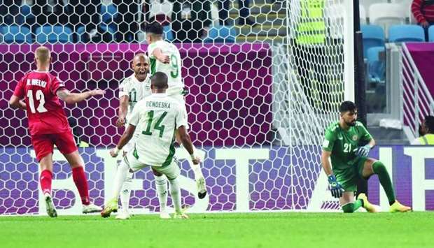 Algeria's Yacine brahimi (centre) celebrates after scoring a penalty during the FIFA Arab Cup Group D match against Lebanon at the Al Janoub Stadium in Al Wakrah Saturday. PICTURE: Shemeer Rasheed