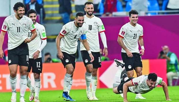 Egyptu2019s Mahmoud Hamdy does push-ups as he celebrates with teammates after scoring against Sudan in the FIFA Arab Cup at Stadium 974 in Ras Abu Aboud Saturday. PICTURE: Noushad Thekkayil