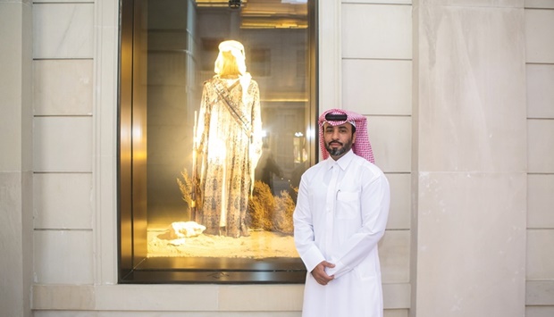 Al-Maadheed with his work on display at Galeries Lafayette Doha.