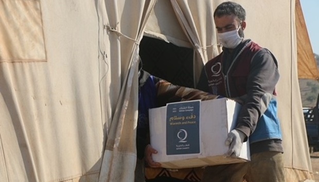 The aid included heaters, charcoal and food baskets, benefiting 12,500 people from the neediest families, and this aid is part of the first convoy of winter aid. @qcharity