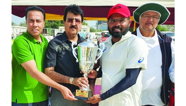 QCA domestic cricket head Gul Khan Jadoon (second from left) presents the winneru2019s trophy to Qatar Airways T20 Division B champions United Challengers at the West Bay Grounds.