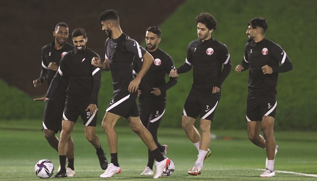 Qatar players train on Sunday, on the eve of their final Group A match against Iraq at the FIFA Arab Cup.