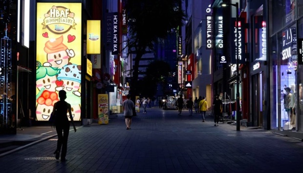 Few people walk on a usually crowded shopping street amid tightened social distancing rules due to the coronavirus disease (Covid-19) pandemic in Seoul, South Korea,
