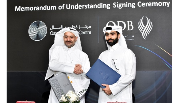 QDB acting CEO Abdulrahman Hesham al-Sowaidi and QFC CEO Yousuf Mohamed al-Jaida shaking hands after signing the MoU during QDB's fourth edition of its Investment Forum held Monday. PICTURE: Thajudheen