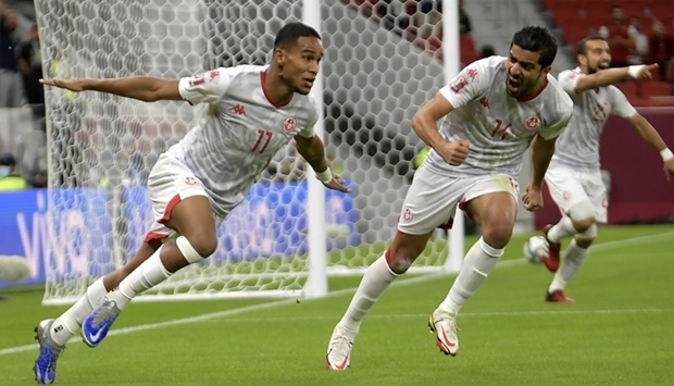 Tunisia's forward Seifeddine Jaziri (left) celebrates after scoring against the UAE during the FIFA Arab Cup Group B match at the Al Thumama Stadium in Doha. PICTURE: Ram Chand