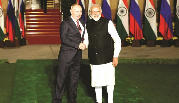 Russiau2019s President Vladimir Putin shakes hands with Indiau2019s Prime Minister Narendra Modi ahead of their meeting at Hyderabad House in New Delhi, India, yesterday.