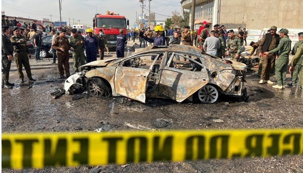 Iraqi security forces inspect the site of an explosion in Basra, Iraq. REUTERS