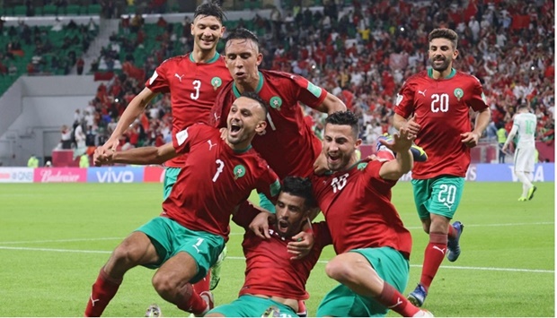 Morocco's Karim El Berkaoui (centre) celebrates with team-mates after scoring against Saudi Arabia during the FIFA Arab Cup Group C match at the Al Thumama Stadium in Doha on Tuesday. PICTURE: Noushad Thekkayil