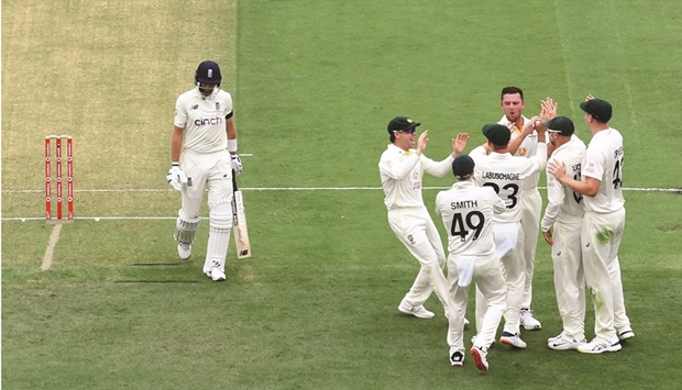 Englandu2019s Joe Root (left) departs for nought after his dismissal by Australiau2019s Josh Hazlewood on day one of the first Ashes