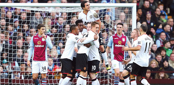 Manchester Unitedu2019s Danny Welbeck (third from left) celebrates his goal with teammates during their EPL match against Aston Villa in Birmingham yester