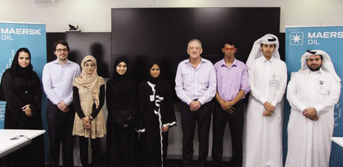 Maersk Oil Qatar officials with some of the selected interns.