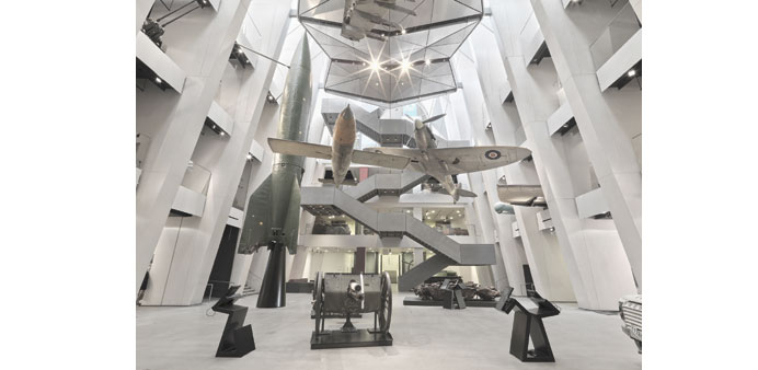 PRESERVED: Missiles, a Spitfire fighter plane and a howitzer on display in the new atrium of the Imperial War Museum, London. Photos: Imperial War Mus