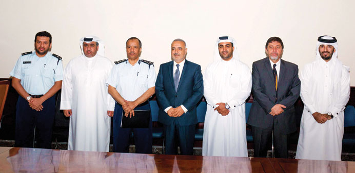 QMIC and Traffic Department officials after the signing of the agreement.
