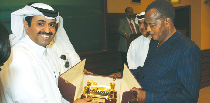 HE Dr Mohamed bin Saleh al-Sada presents a souvenir to Denis Sassou Nguesso at Ras Laffan Industrial City. 