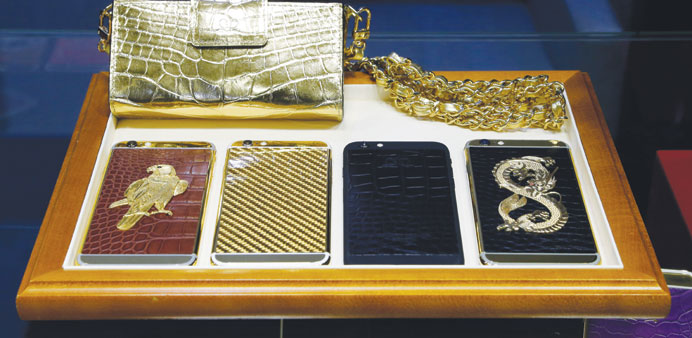The gold-plated laden iPhones and purse showcased at Al Bidda pavilion. Each of them costs anywhere between QR50,000 and QR100,000. PICTURE: Jayaram