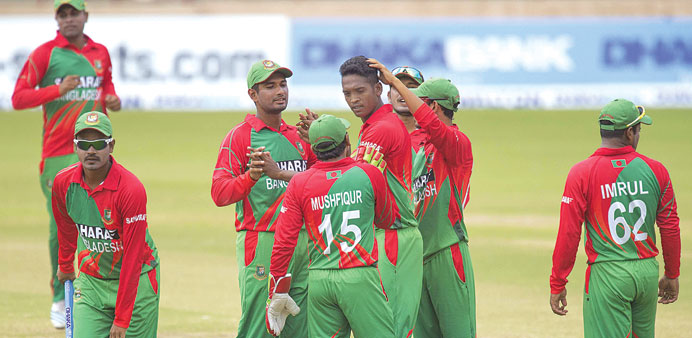 Bangladesh bowler Al-Amin Hossain (centre) celebrates with teammates after dismissing West Indies batsman Kirk Edwards in Grenada. (AFP)