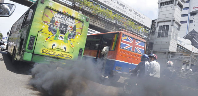 This file picture dated December 7, 2009 shows a commuter bus running on diesel fuel belching smoke in Jakarta.