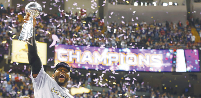 Baltimore Ravensu2019 Lewis hoists Lombardi Trophy while celebrating victory in Super Bowl XLVII in New Orleans on Sunday. (Reuters)