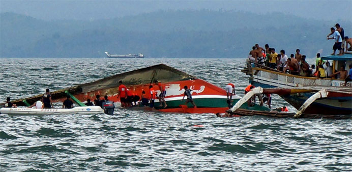 Rescuers search for survivors at the site of the capsized passenger ferry off Ormoc City, central Philippines