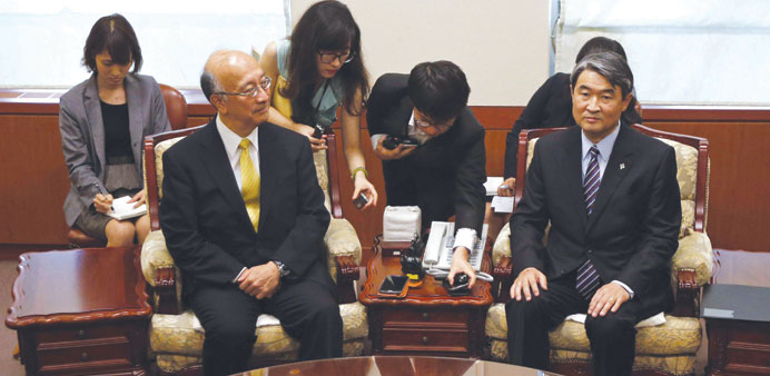 South Koreau2019s Vice Foreign Minister Cho Tae-yong (right) and Japanese Ambassador to South Korea Bessho Koro take their seats for a meeting at the fore