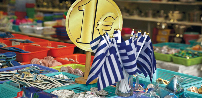 Greek flags being displayed for sale for one euro at a shop in central in Athens.