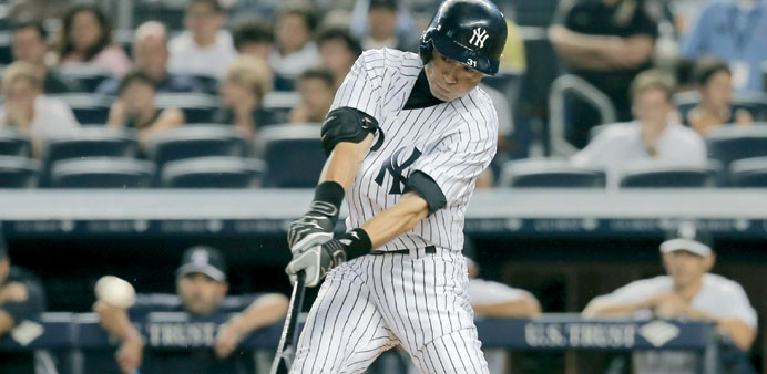 New York Yankees batter Ichiro Suzuki hits a single against the Detroit Tigers in the first inning of their MLB American League game at Yankee Stadium