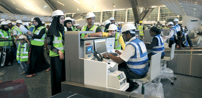  u2018Passengers checking inu2019 during the trial at Hamad International Airport.
