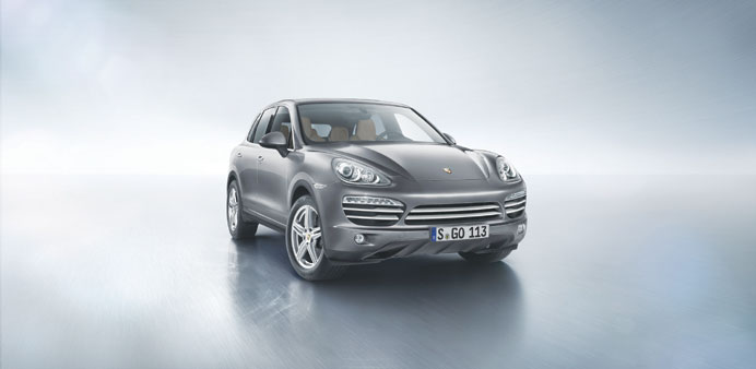 The Porsche Cayenne Platinum Edition. Below, right: An interior view of the SUV.