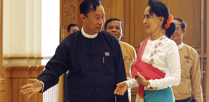 Shwe Mann, speaker of Myanmaru2019s parliament, greets Aung San Suu Kyi before their meeting yesterday.