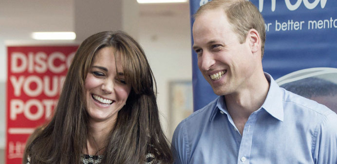 Prince William, Duke of Cambridge and Catherine, Duchess of Cambridge smile during an event in London to mark World Mental Health Day yesterday.