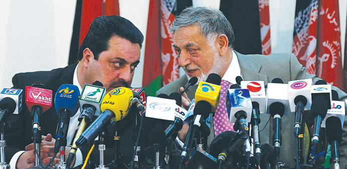 Ahmad Yusuf Nuristani (right), Chairman of Independent Election Commission of Afghanistan,speaks during a news conference in Kabul yesterday.