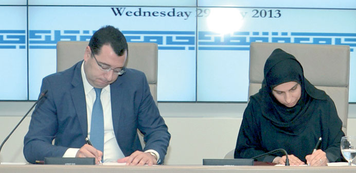The signing ceremony in progress at the QU premises.