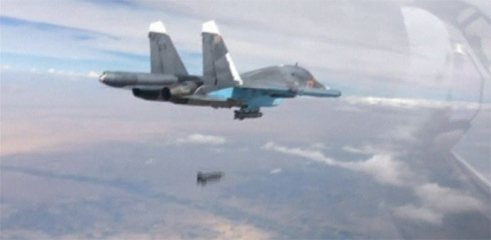 Footage released by Russia's Defence Ministry, shows a Su-34 fighter-bomber dropping a bomb over Syria