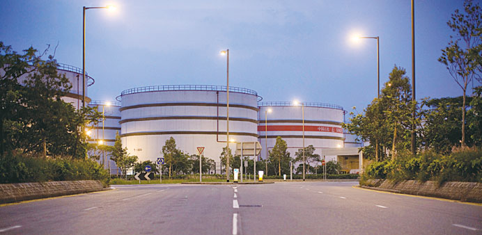 Sinopec storage tanks stand in Hong Kong. The state-run oil group said it would cut capital expenditure to $25.96bn this year.