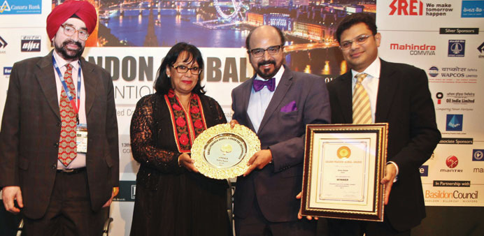 Seetharaman receiving the Golden Peacock Award from Baroness Verma in London.