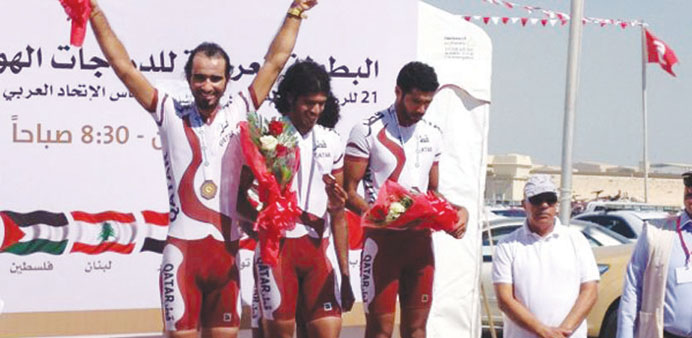 Qatar team members celebrate on the podium after winning bronze medal in the seniorsu2019 team trial event at the 21st Arab Cycling Championship in Bahrai