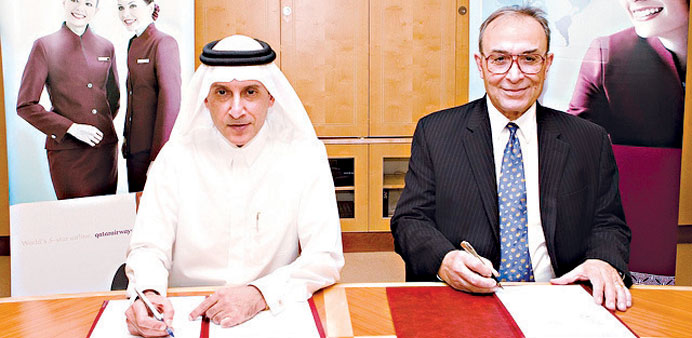 Akbar al-Baker and Dr Ilker Baybars signing the MoU.