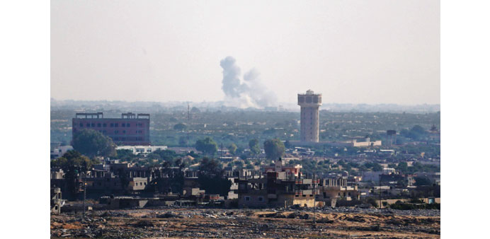 Smoke rises in North Sinai as seen from the border of the Gaza Strip with Egypt yesterday.