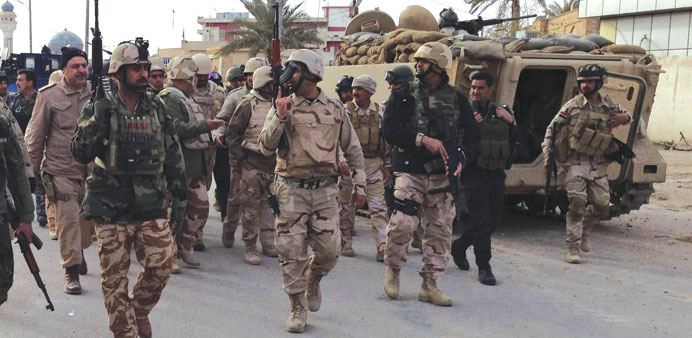 Iraqi soldiers deploy on the outskirts of Anbar province yesterday.