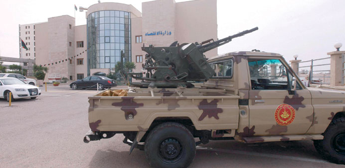 A military vehicle is seen at the ministry of economy in Tripoli yesterday.