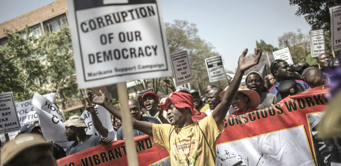 An anti-corruption activist shouts slogans in Pretoria during a demonstration against corruption organised by various South African unions and politic