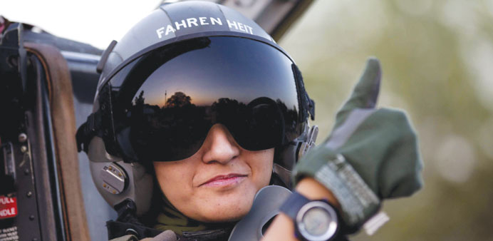 Ayesha Farooq, 26, Pakistanu2019s only female war-ready fighter pilot, gives the thumb-up sign from the  cockpit of a Chinese-made F-7PG fighter jet at Mu