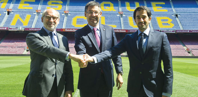 Essa al-Mannai, Josep Maria Bartomeu, and Gerard Boquenet in Barcelona. 