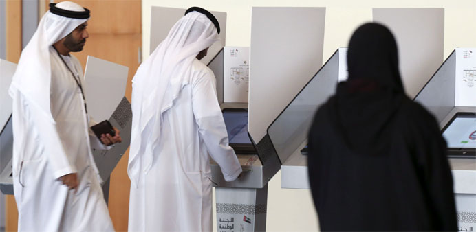 Emiratis cast their vote at a polling centre in the Gulf emirate 